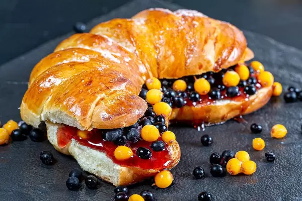 Sandwich with sea buckthorn berries, elderberries and jam