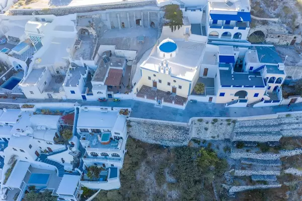Santorini from above: the white and blue houses and terraces of Firá