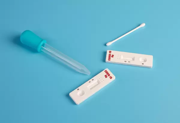SARS-CoV-2 Rapid Antigen Tests on blue background