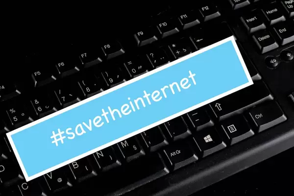 #savetheinternet text on a black computer keyboard