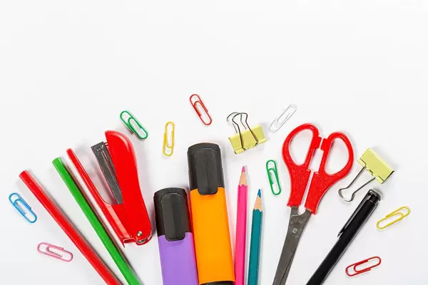 School supplies on white background. Markers, scissors, pencils and paper clips (Flip 2019)
