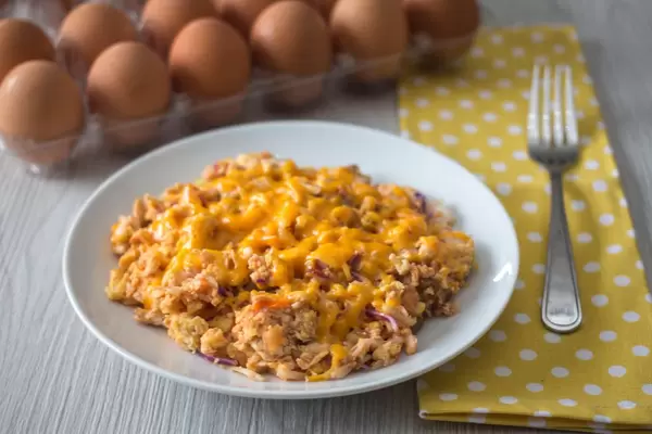 Scrambles eggs with cheese on top