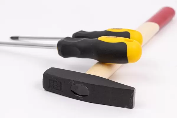 Screwdrivers and Hammer isolated above white background