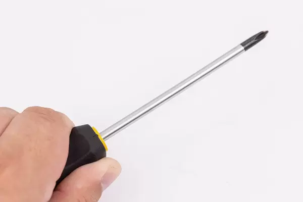 Screwdrivers in the hand above white background