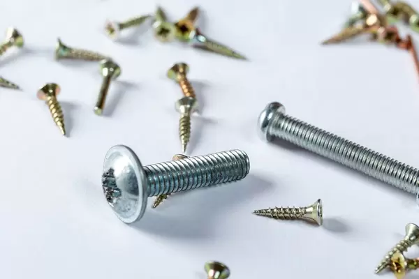 Screws and bolts on white background