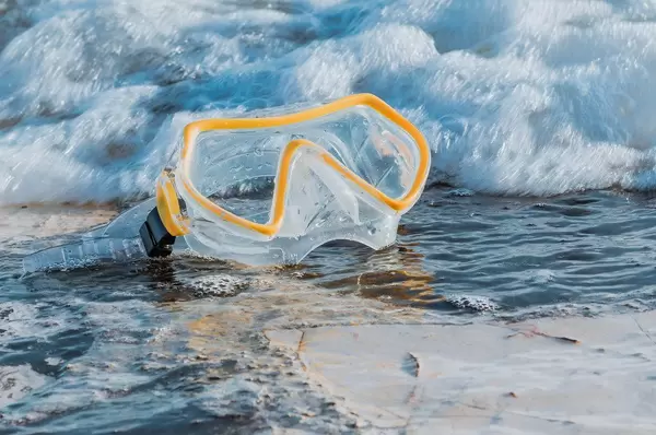 Scuba diving mask at the beach