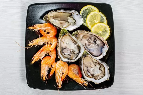 Sea delicacies-shrimp and oysters. Top view