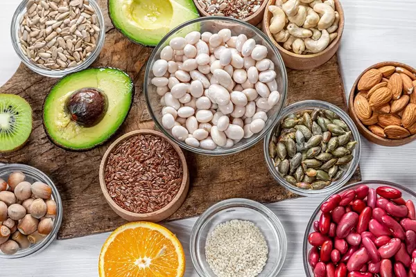 Seeds, nuts and fruit on an old kitchen Board. Top view (Flip 2019)