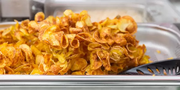 Self-made snack: baked potato crisps