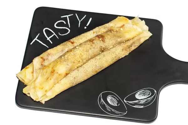 Serbian traditional Pancakes served on the black tray