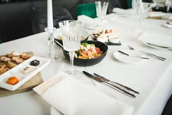 Served Dinner Table With Salad And Bread