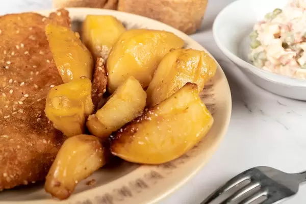 Served lunch with Fried Pork Meat with baked Potatoes and Vegetable salad (Flip 2019)