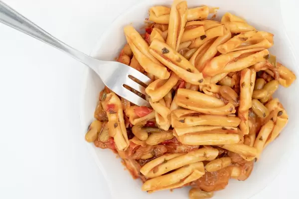 Served Pasta with Tuna on the white plate