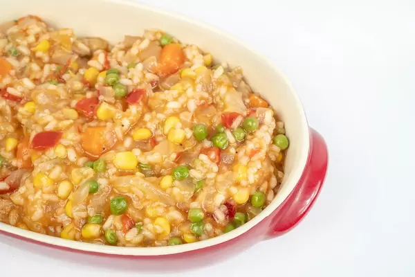 Served Risotto with Vegetables above white background (Flip 2019)