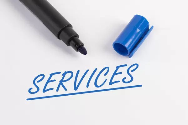 Services text with blue marker pen
