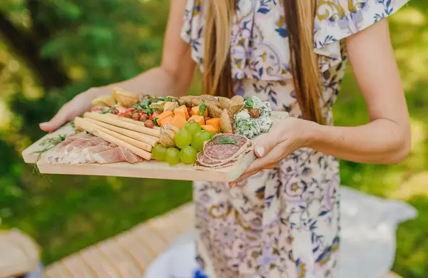 Serving Mediterranean Snacks With Grpes, Salami, Cheese