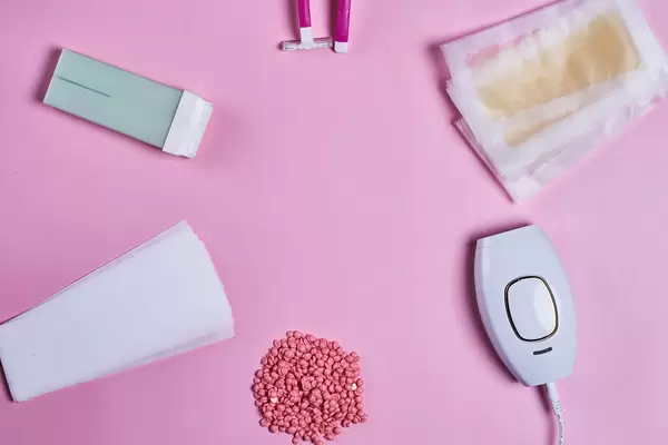 Set for epilation on colored background with copy space