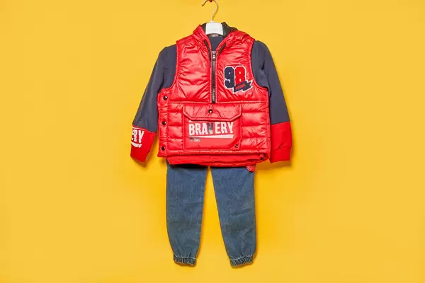 Set of baby accessories on yellow colored background