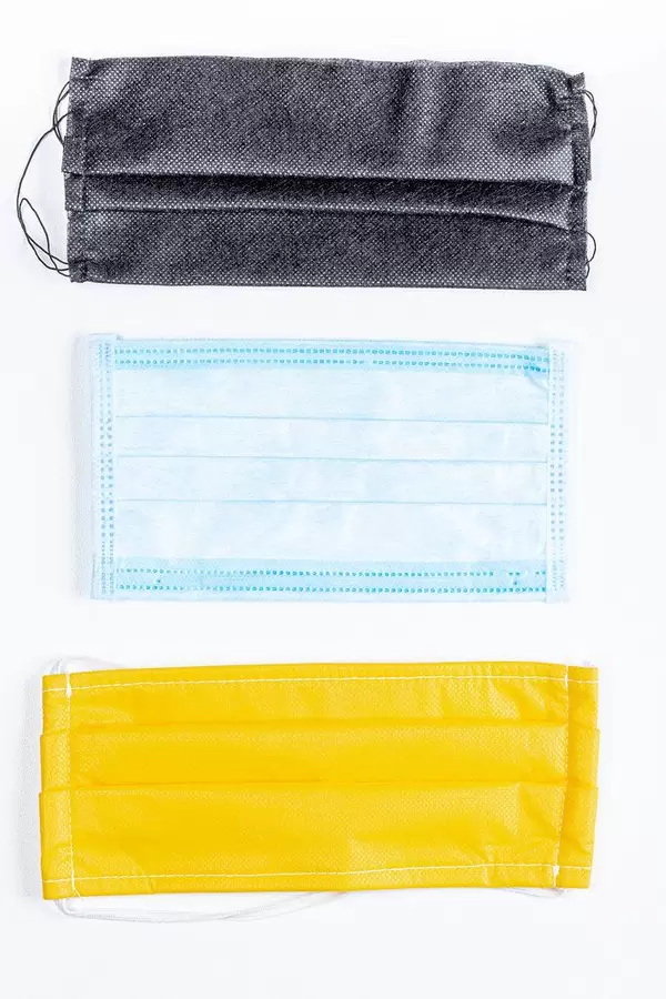 Set of different medical masks on a white background