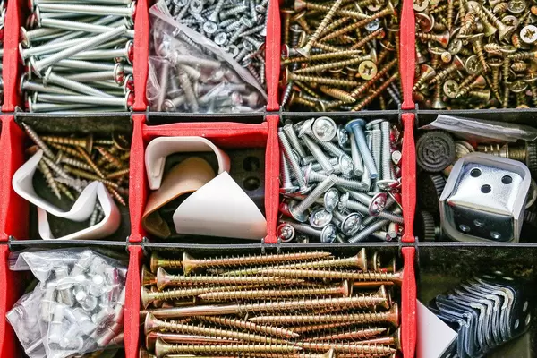 Set of fasteners and screws in a box