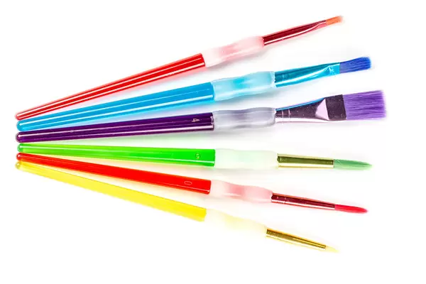 Set of multi-colored paint brushes, top view