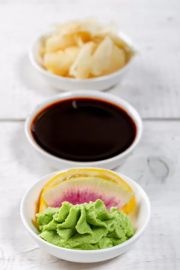 Set of traditional sauces and pickled ginger for sushi