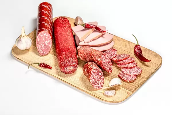 Set smoked salami and sausage on a wooden kitchen Board (Flip 2020)