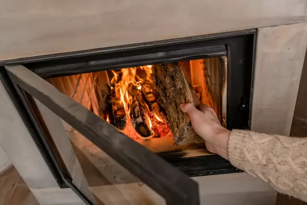 Setting Fireplace With Wood By Hand