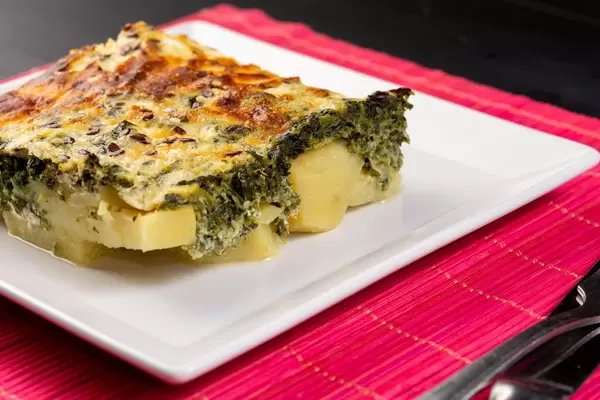 Seved Spinach Pie with Potatoes on the plate (Flip 2019)