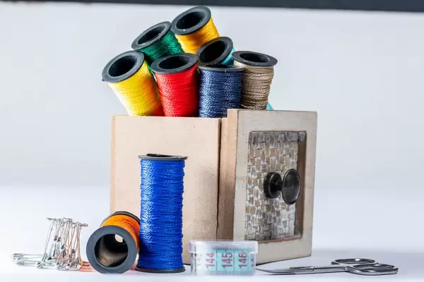 Sewing accessories on white background