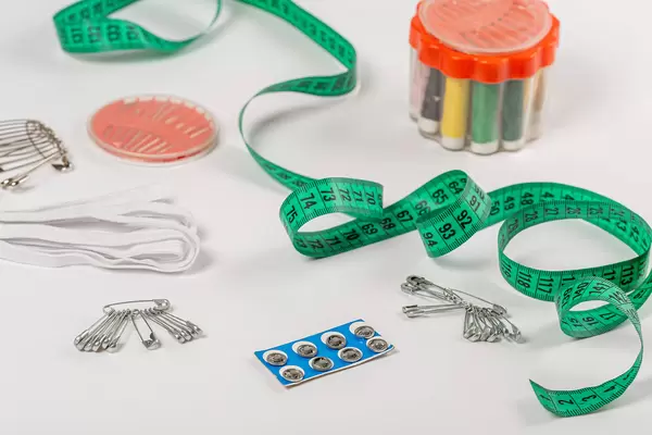 Sewing kit with tape measure and pins