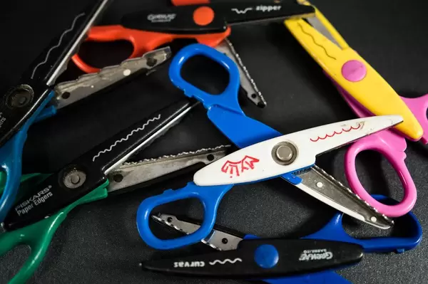 Shape cutting scissors on a black surface