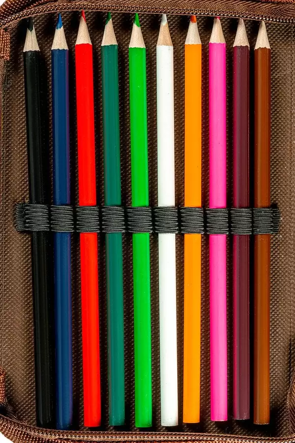 Sharpened colored pencils in a pencil case, top view