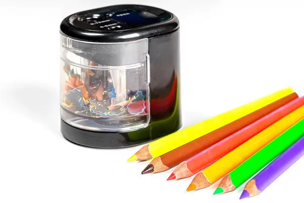 Sharpening a pencil with colored pencils