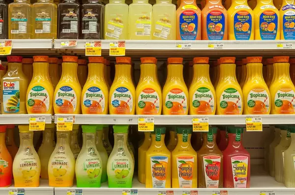Shelf in a grocery store with different juice variations