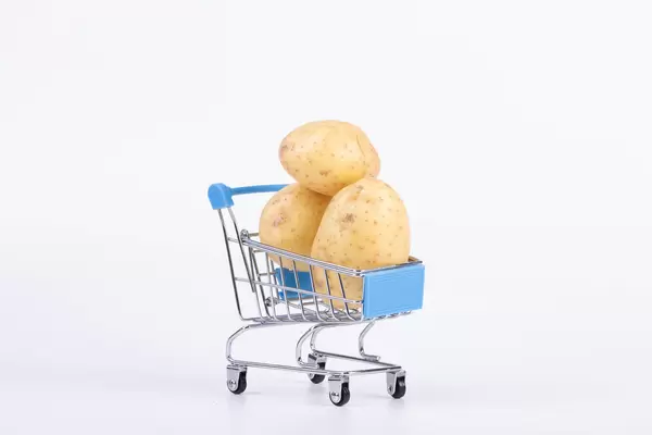 Shopping cart full of potatoes