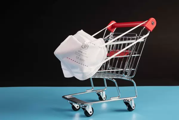 Shopping cart with medical FFP2 mask