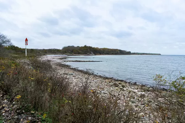 Shore of the Baltic Sea near Kiel with huge “No anchoring” sign for the boats