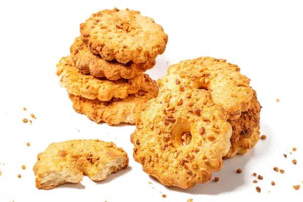 Shortbread cookies with peanuts on a white background