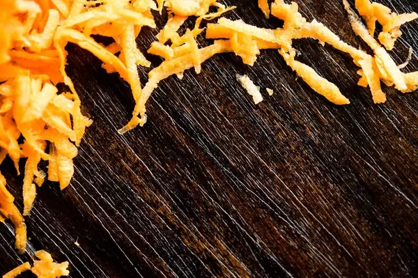Shredded carrot forming nice frame on wood