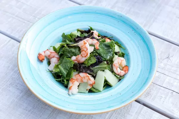 Shrimp salad with melon, prosciutto and lemon-caviar cream