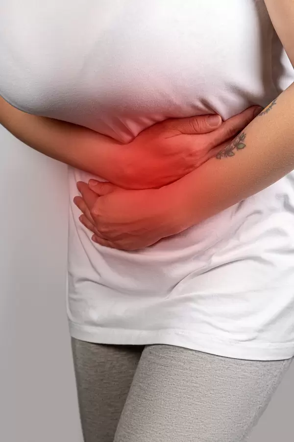 Sick woman having a stomach ache