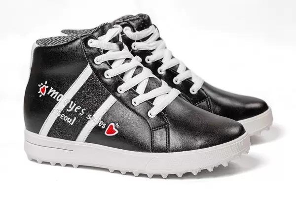 Side view of a on women's black sneakers