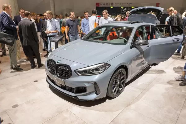 Side view of the BMW 1 series car M135i xDrive on an international car exhibition