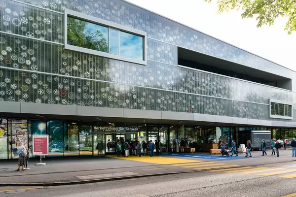Side view of the Swiss museum of transportation with multitude of car rims displayed