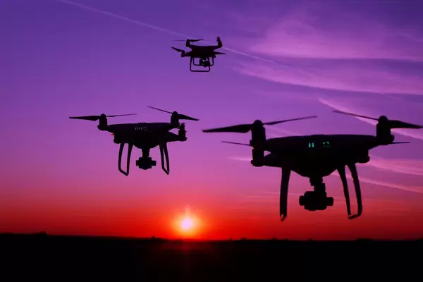 Silhouette of drones in the sky