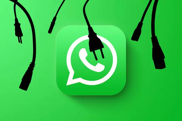 Silhouettes unplugged data cables and plugs over WhatsApp logo - WhatsApp global outage