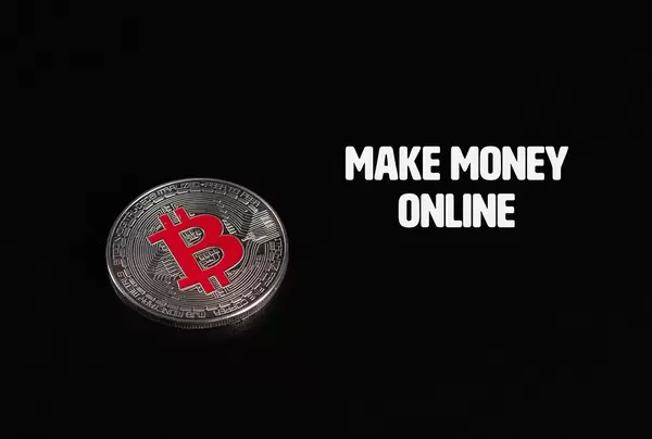 Silver Bitcoin coin with Make Money Online text on black background