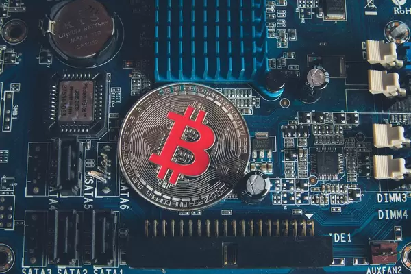 Silver Bitcoin on a Mother board