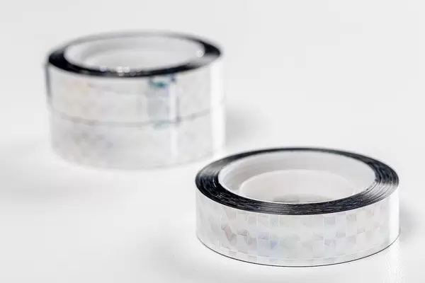 Silver shiny decorative tape on a white background (Flip 2019)